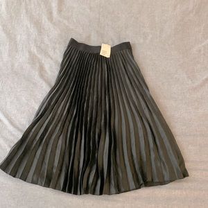 Black, mid length skirt. H&M size 4. Looks like black silk.